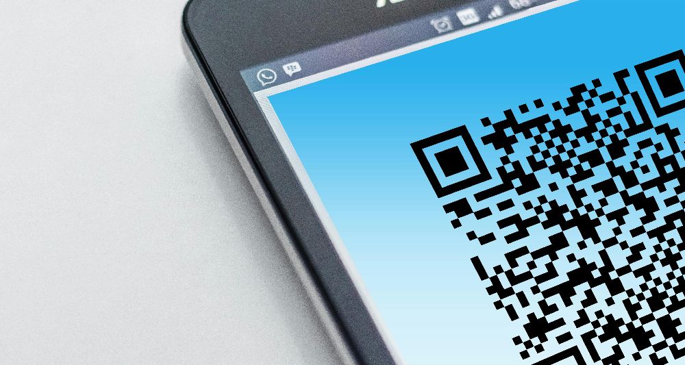 Branded merchandise with QR code linking to digital content