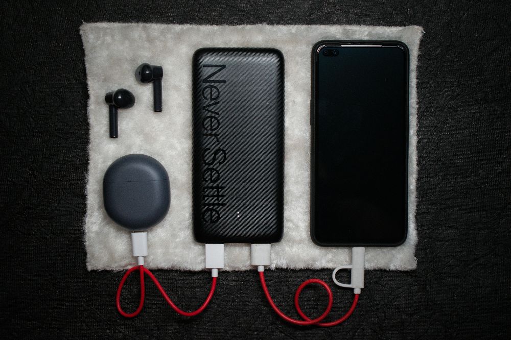 Tech accessories set including power bank and earphones with logo